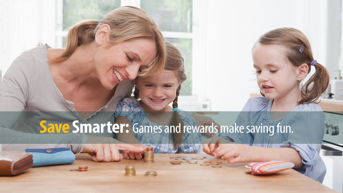 Mother teaches her two daughters about money and saving using coins.